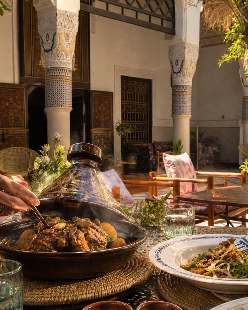 Moroccan tagine dining scene in a traditional courtyard